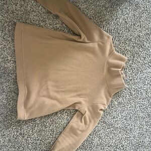 Dudley Stephen’s camel colored green point turtleneck